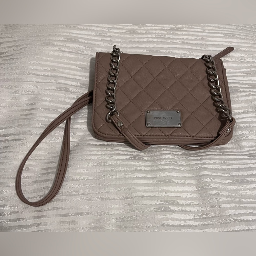 Nine West beige crossbody. Front metal area has some wear.